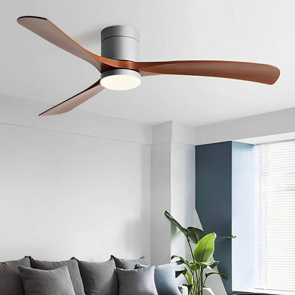 Scandinavian ceiling fan with walnut-finish blades, grey motor housing, and integrated LED light in a modern living room.