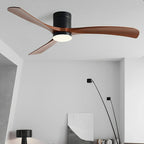 Scandinavian ceiling fan with three walnut wood blades, black motor housing, and integrated LED light.