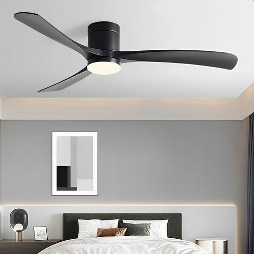Matte black Scandinavian ceiling fan with three slender blades and an integrated LED light in a modern bedroom.