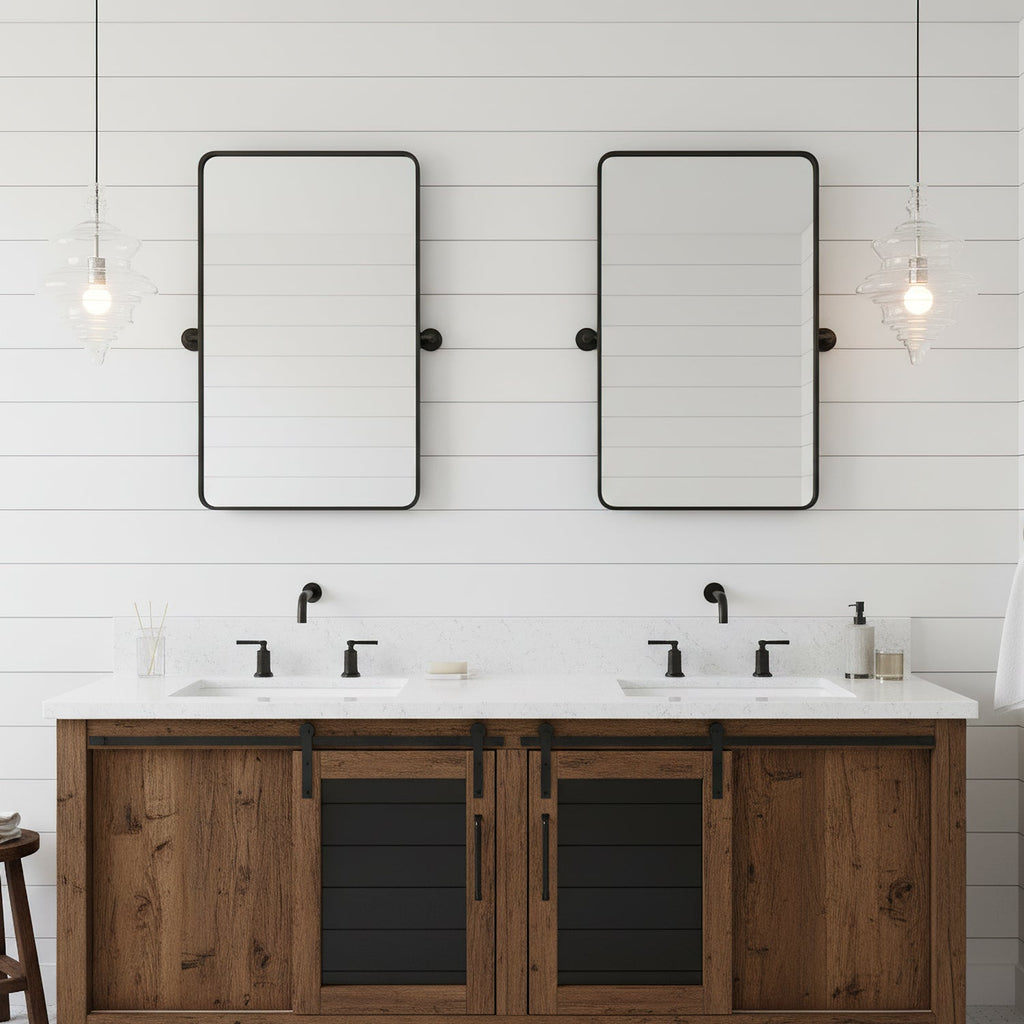 Sculptural clear glass pendant light with rippled texture hanging above a rustic double vanity in a modern bathroom.