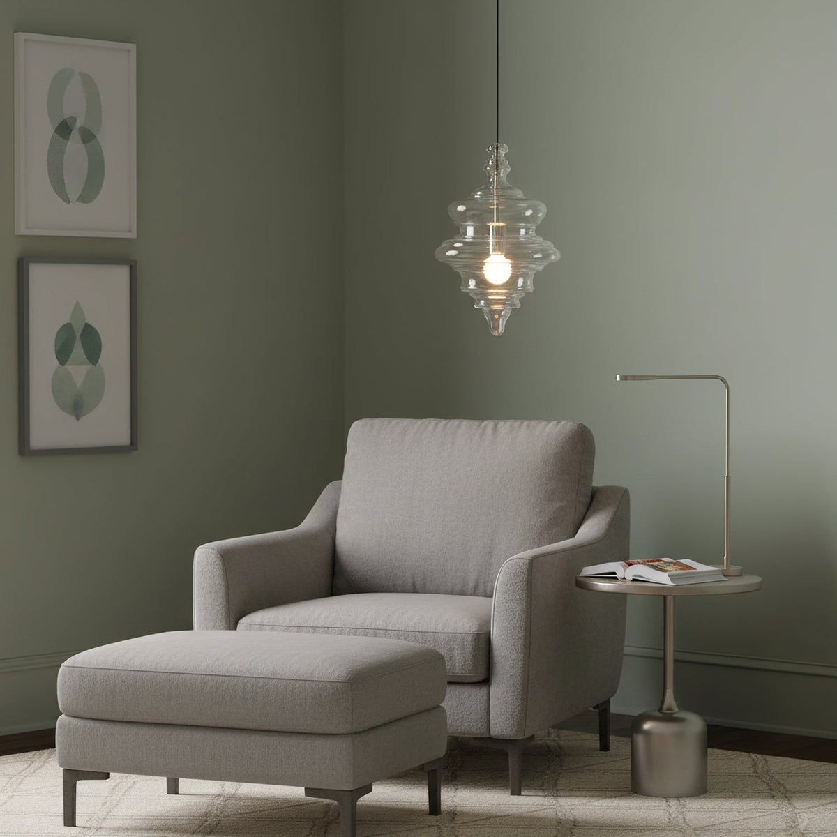 Sculptural clear glass pendant light with a rippled design hanging above a grey armchair in a modern living room.