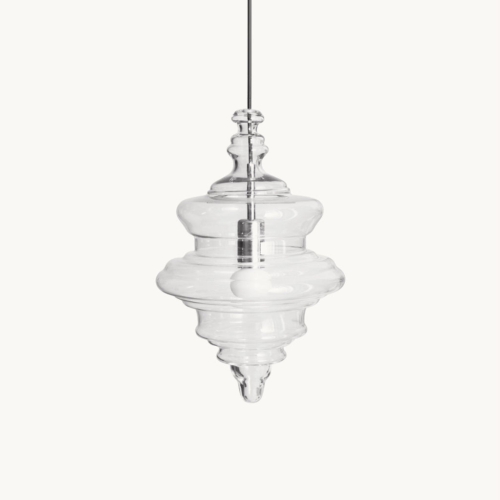 Sculptural clear glass pendant light with a rippled, theatre-inspired silhouette and a central filament bulb.