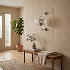 Clear Glass Wall Light – Silver / A in an entrance hall above a slim walnut bench