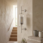 Clear Glass Wall Light – Silver / B in a staircase landing with limewashed walls