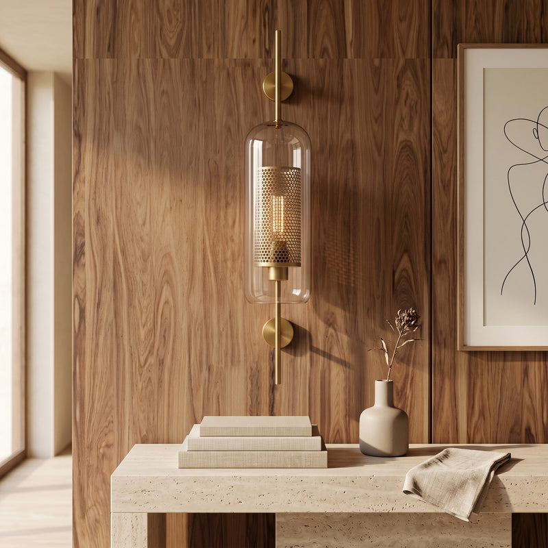 Clear Glass Wall Light – Brass / B in a bright living room above a travertine console