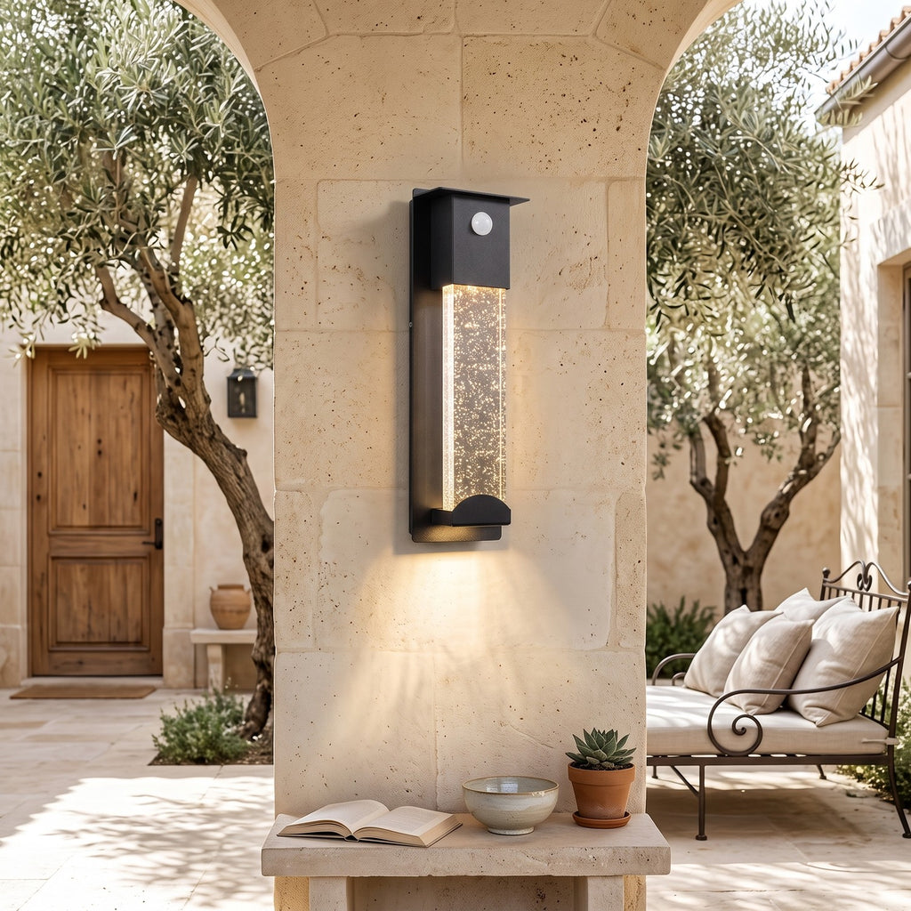 Crystal Effect Outdoor Wall Light – SENSOR in a courtyard with olive trees and limestone walls