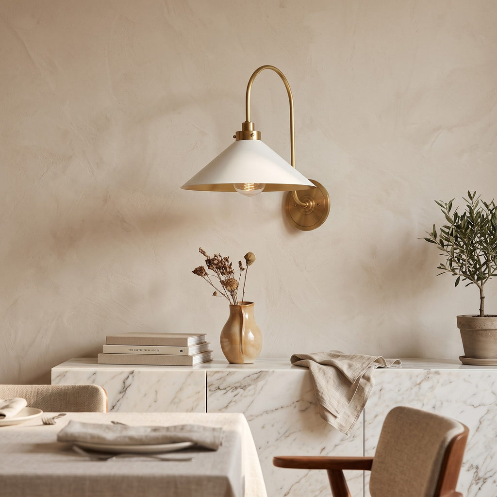 Curved Arm Cone Wall Light – Brass+White in an elegant dining room above a marble sideboard