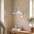 Curved Arm Cone Wall Light – Nickel+Blue in a staircase landing with limewashed walls