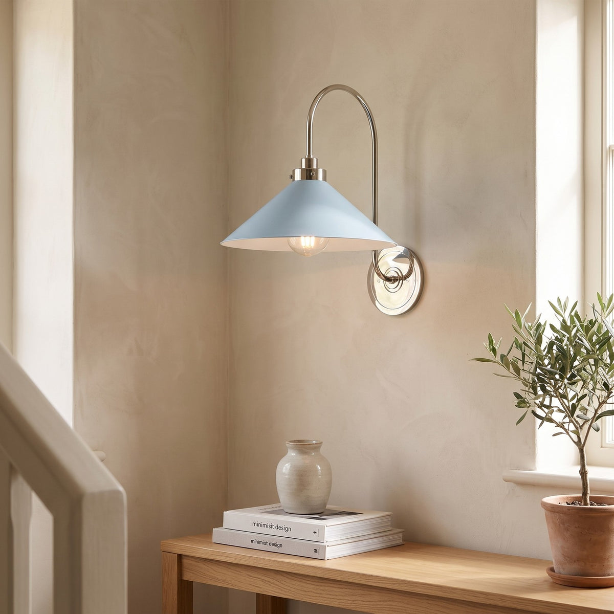Curved Arm Cone Wall Light – Nickel+Blue in a staircase landing with limewashed walls