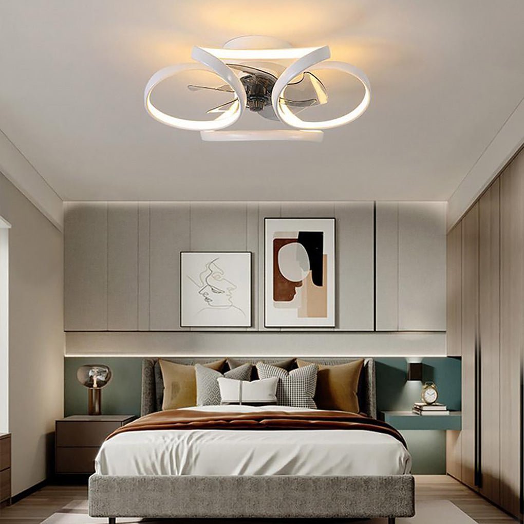 Modern white flush mount ceiling fan with integrated LED flower-petal design installed in a contemporary bedroom.