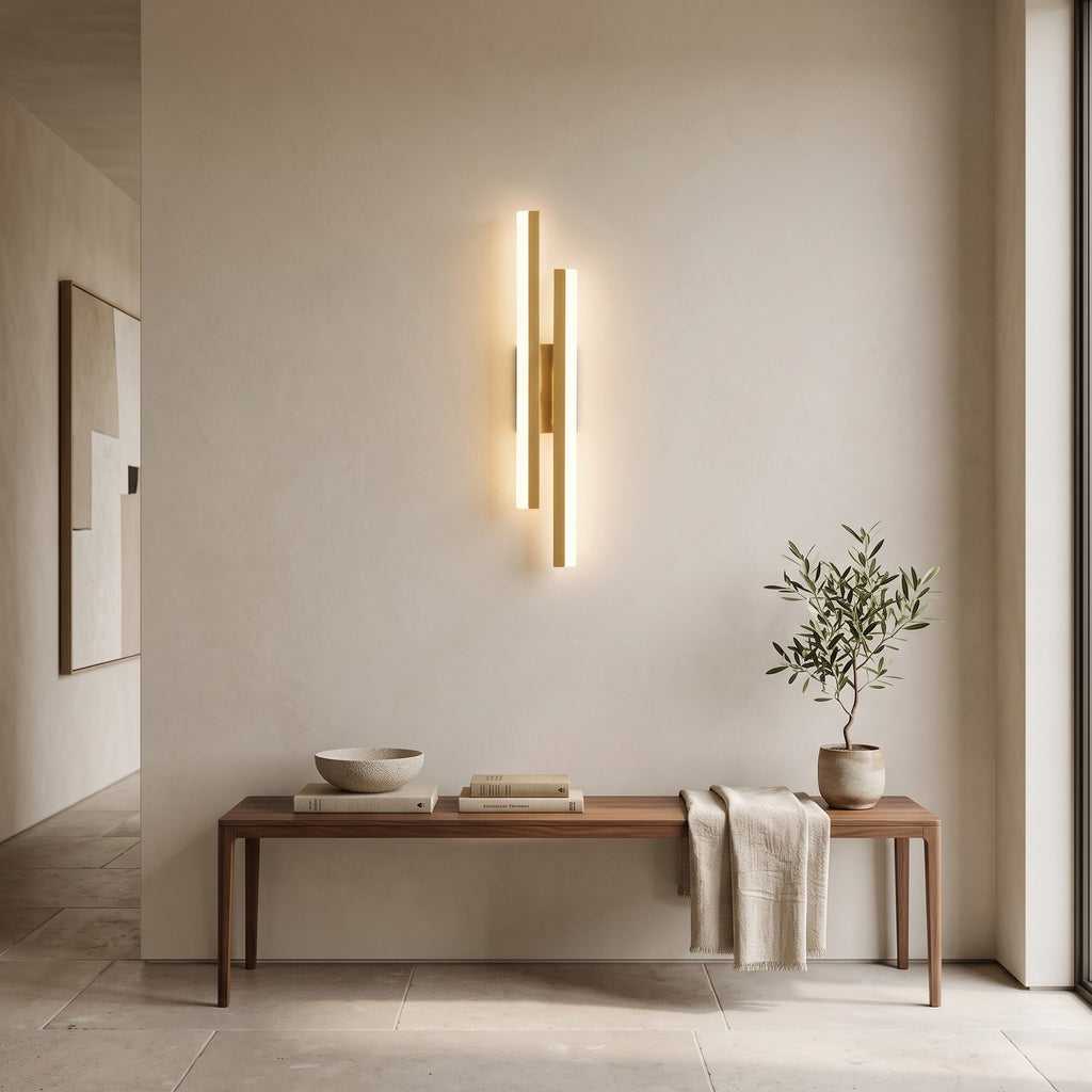 Geometric LED Wall Light – Gold / Left in an entrance hall above a slim walnut bench