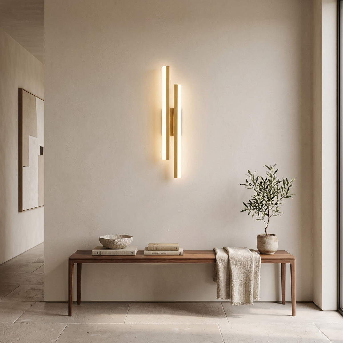 Geometric LED Wall Light – Gold / Left in an entrance hall above a slim walnut bench