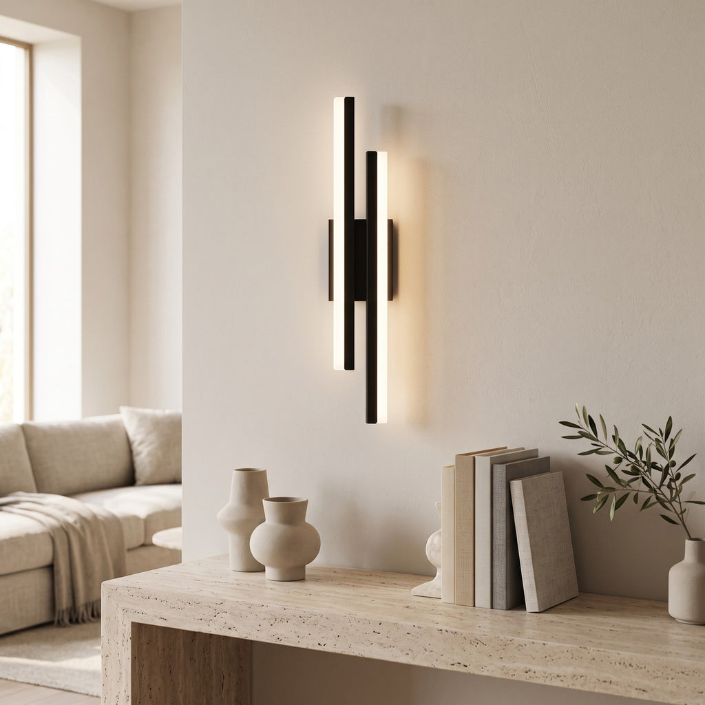 Geometric LED Wall Light – Black / Left in a bright living room above a travertine console
