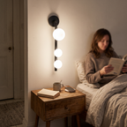 3 Light Glass Globe Wall Light in bedroom above bedside table - Valentina