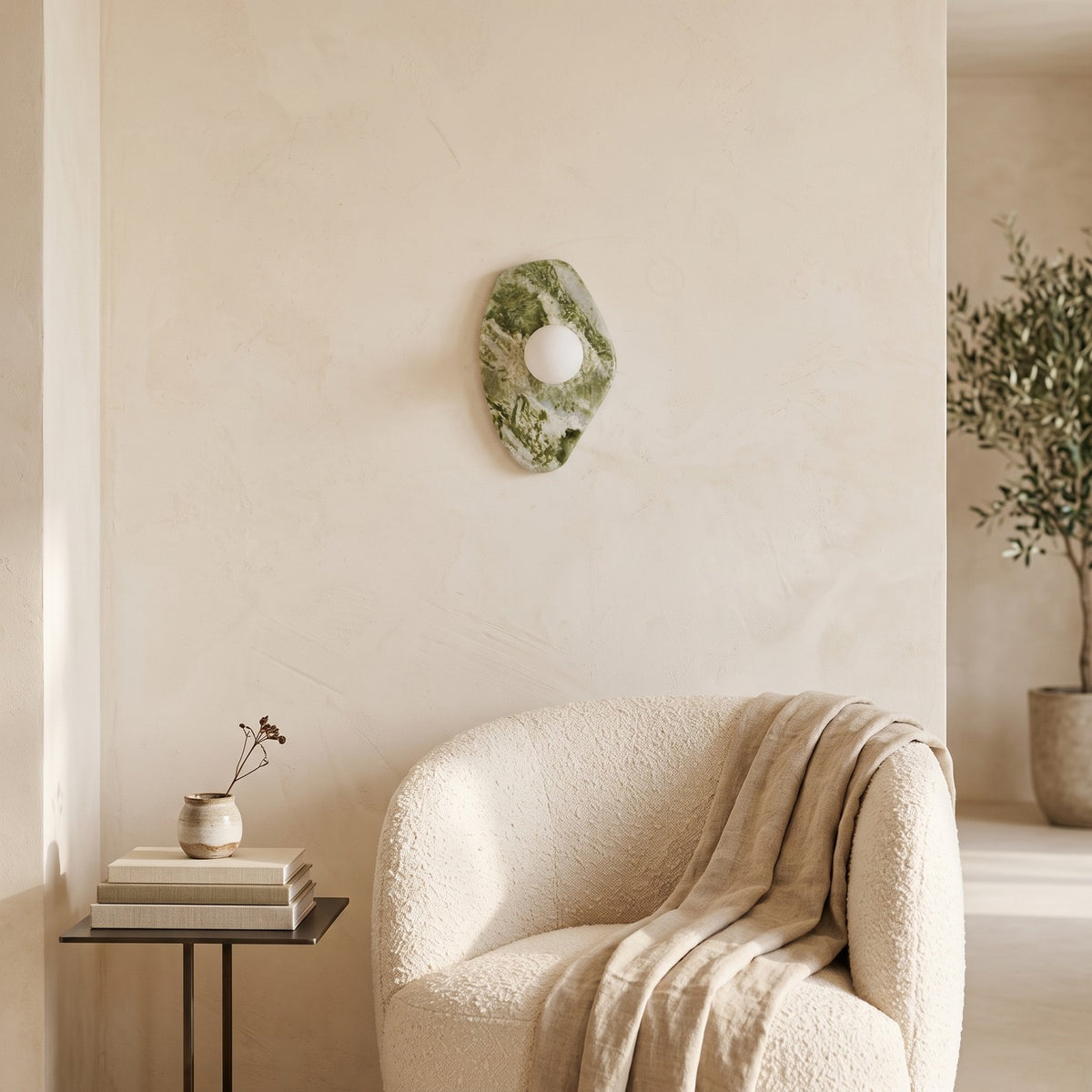 Green Marble Wall Light – Model A in a quiet reading corner above a boucle armchair
