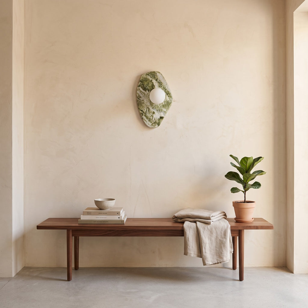 Green Marble Wall Light – Model A in an entrance hall above a slim walnut bench