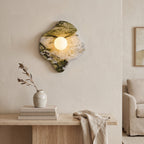 Green Marble Wall Light – Model C in a bright living room above a travertine console