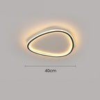 Minimalist 40cm black aluminium flush ceiling light with a soft, glowing integrated LED silicone diffuser.