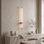LED Tube Wall Light – Copper-mid in an elegant dining room above a marble sideboard