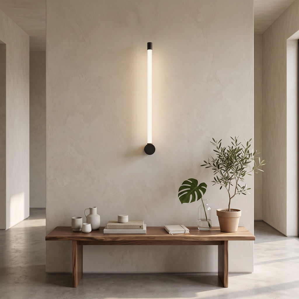 LED Tube Wall Light – Black-end in an entrance hall above a slim walnut bench