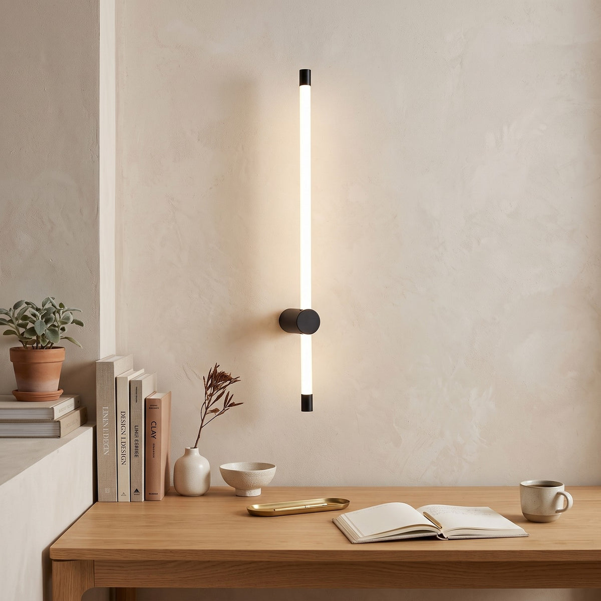 LED Tube Wall Light – Black-mid in a calm home office above a solid oak desk