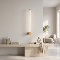 LED Tube Wall Light – Copper-end in a bright living room above a travertine console