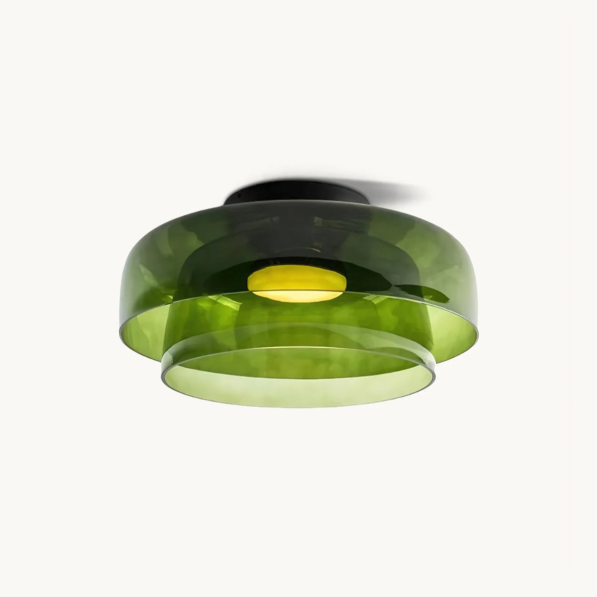 Retro layered green glass ceiling light with a stacked design and warm glowing center on a white background.