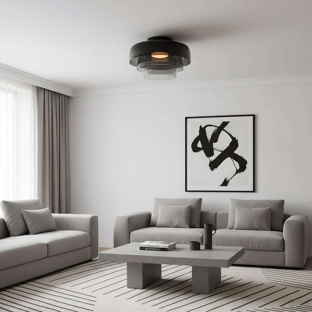 Retro layered ceiling light with smoky grey glass tiers in a modern living room with grey sofas.