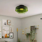 Retro layered green glass ceiling light with a stacked design mounted on a white ceiling.