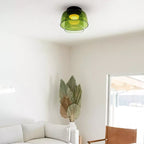Retro layered green glass ceiling light with a stacked design in a modern living room.