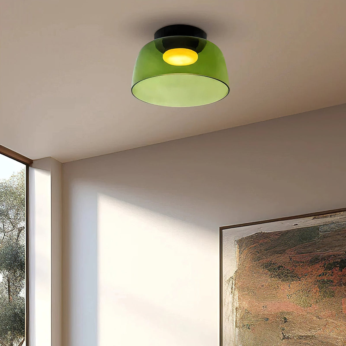 Retro green layered glass ceiling light with a warm glowing center mounted on a white ceiling.