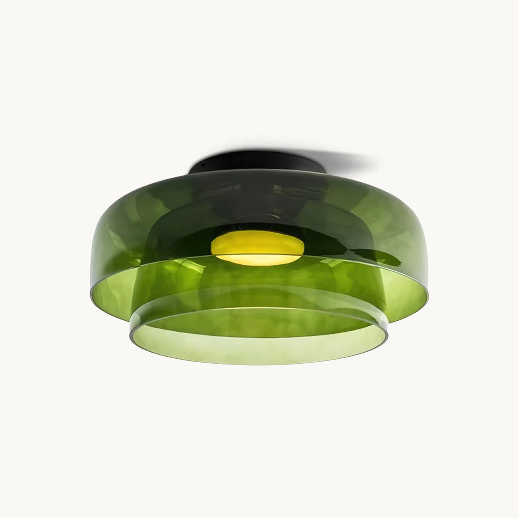 Retro layered green glass ceiling light with stacked tiers and a warm glowing center on a white background.