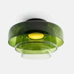 Retro green layered glass ceiling light with stacked tiers and a warm glowing center.