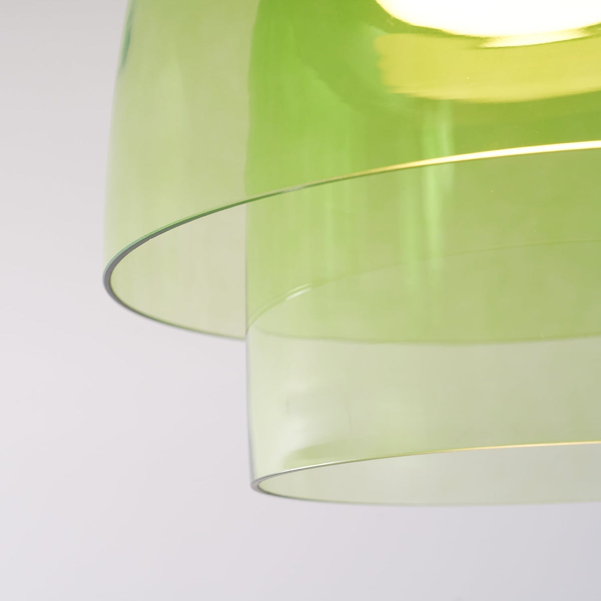 Retro layered ceiling light featuring stacked tiers of translucent green glass for a soft, gradient glow.