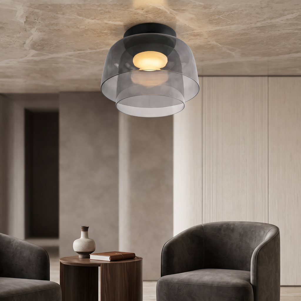 Retro layered ceiling light in smoky grey glass with a warm glowing center, mounted in a modern neutral interior.