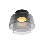 Retro layered ceiling light featuring stacked smoky grey glass tiers with a warm glowing center against a black mount.