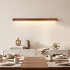 Linear Wood LED Wall Light – Brown in an elegant dining room above a marble sideboard