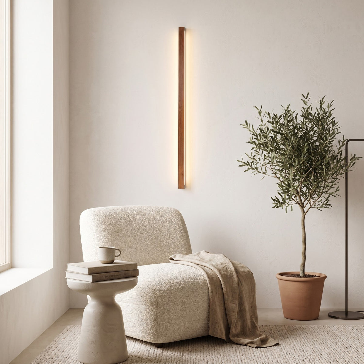 Linear Wood LED Wall Light – Brown in a quiet reading corner above a boucle armchair