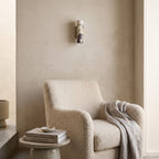 Marble Cylinder Wall Light – H 24cm in a quiet reading corner above a boucle armchair