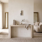 Marble Cylinder Wall Light – H 24cm in a bright living room above a travertine console