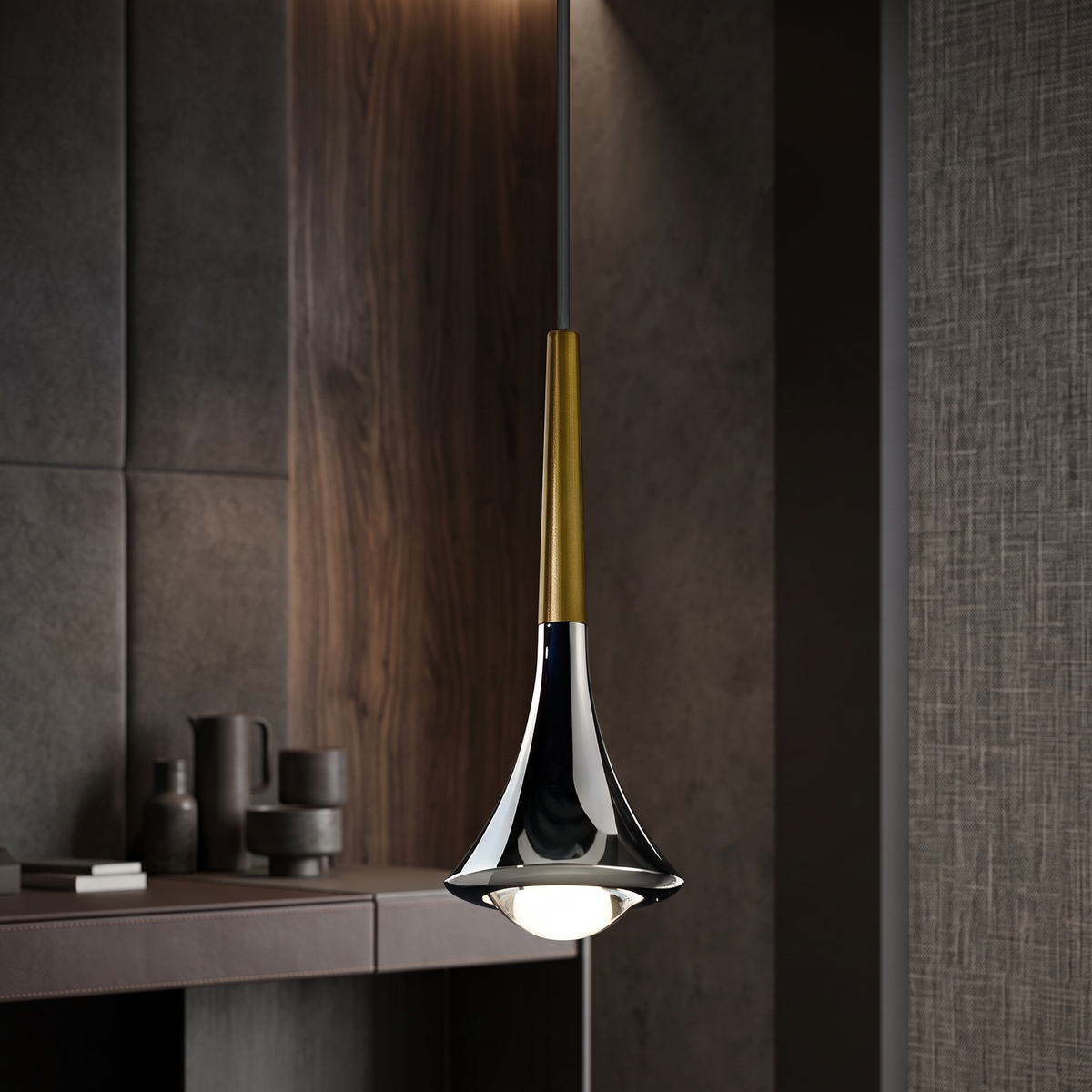 Modern teardrop pendant light with a sleek chrome and gold finish, featuring a compact LED design for focused lighting.