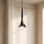 Modern chrome teardrop mini pendant light with a matte black top and integrated LED, hanging in a minimalist interior.