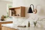 Nordic Wood Wall Light in black on the wall of a marble kitchen