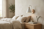 Nordic Wood Wall Light in white above a bedside table in a serene bedroom
