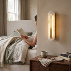 Oval Alabaster Style Wall Light with Brass in bedroom above bedside table - Kristy