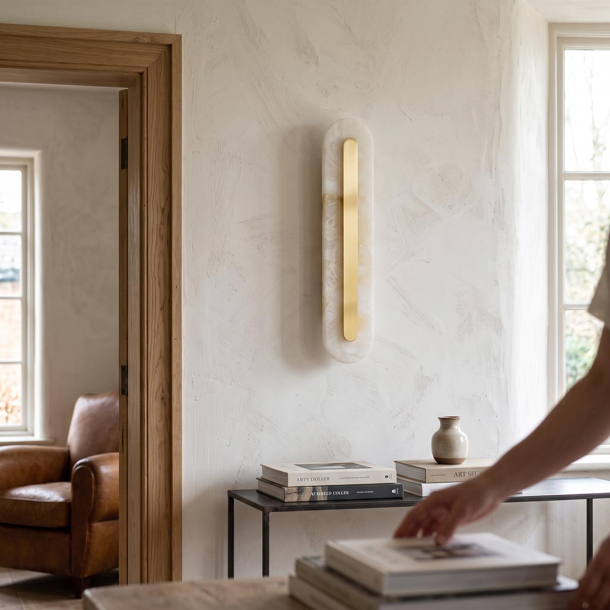 Oval Alabaster Style Wall Light with Brass detail in daylight - Kristy