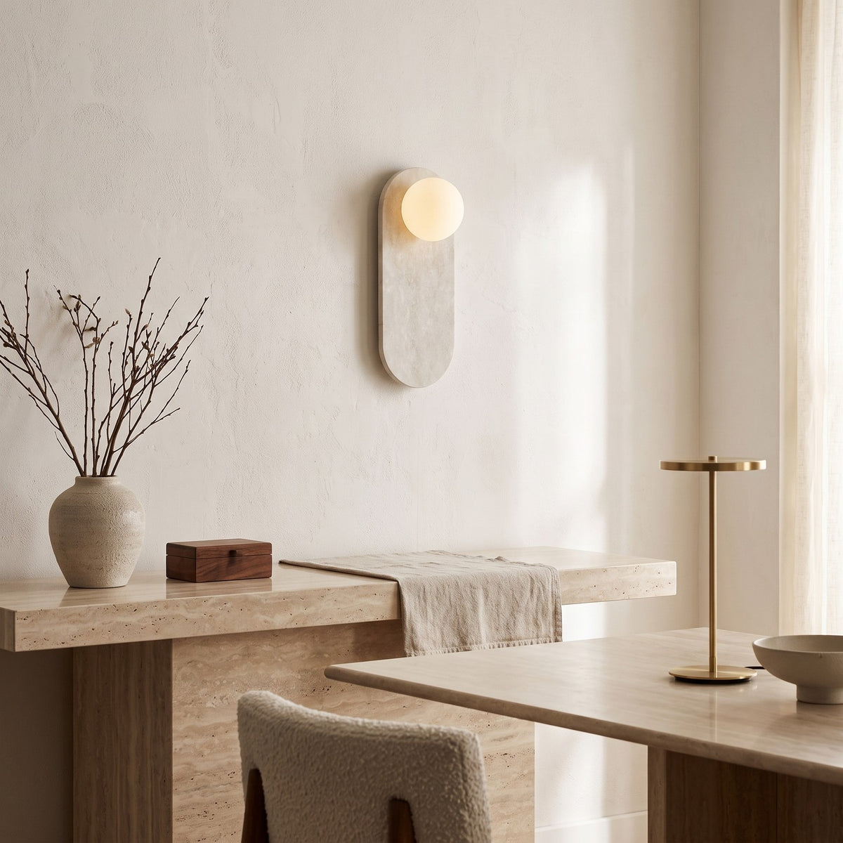 Oval Marble Wall Light – Beige in an elegant dining room above a marble sideboard