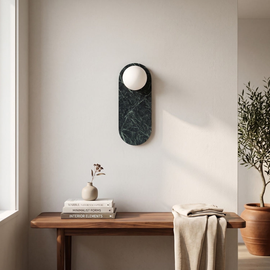Oval Marble Wall Light – Dark Green BStyle in an entrance hall above a slim walnut bench