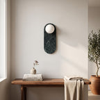 Oval Marble Wall Light – Dark Green BStyle in an entrance hall above a slim walnut bench