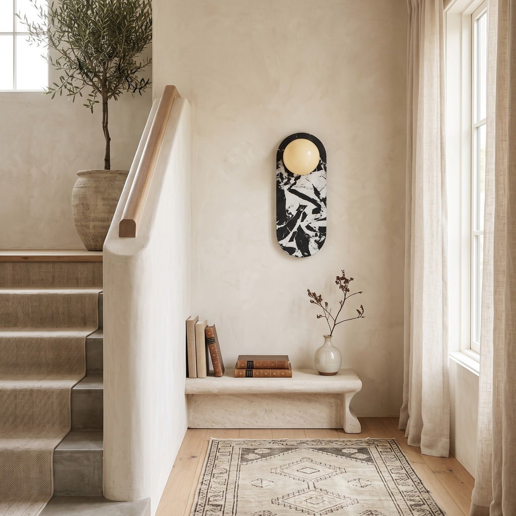Oval Marble Wall Light – Black White BStyle in a staircase landing with limewashed walls